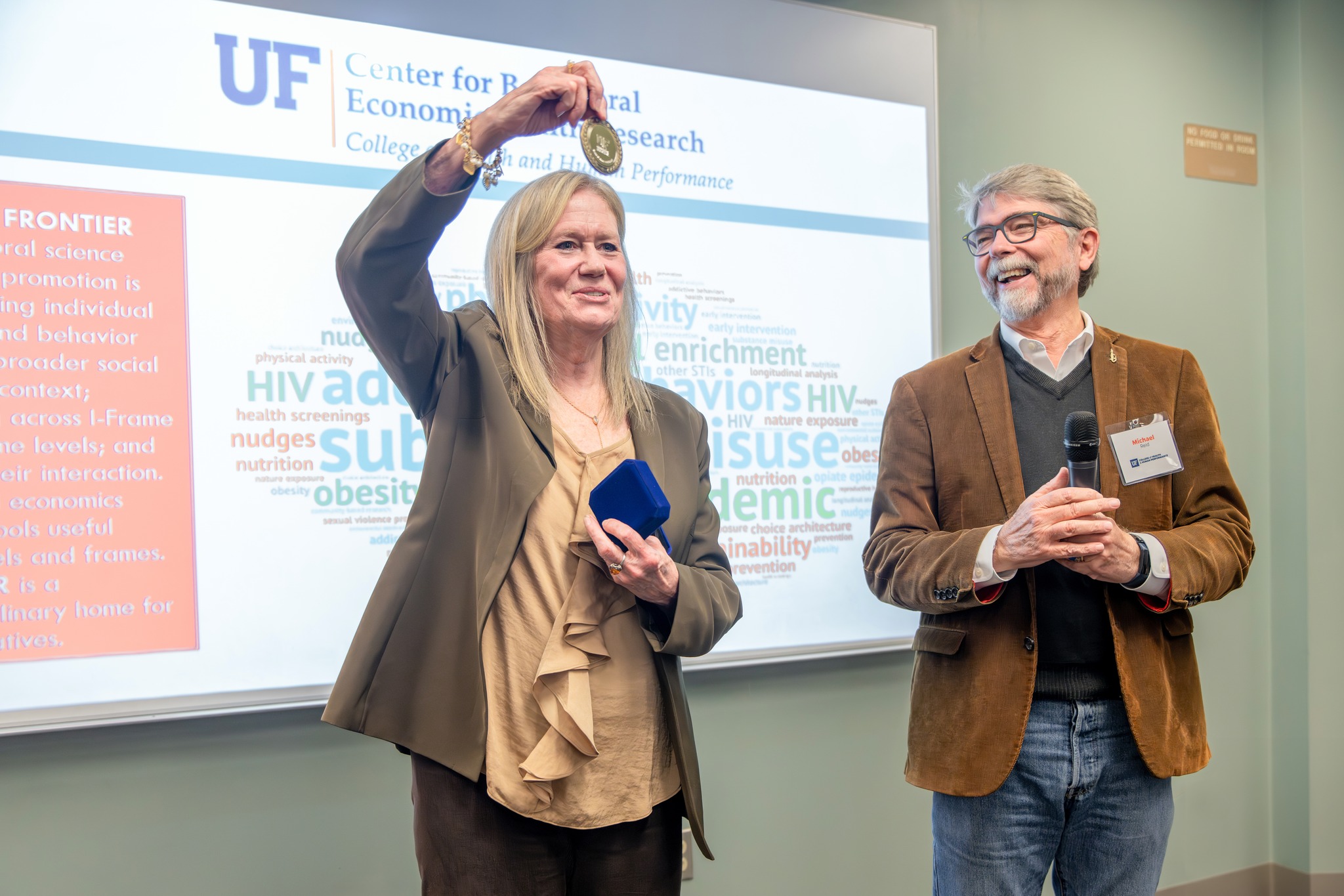 Dr. Jalie Tucker and Dean Michael Reid at the installation ceremony on November 29, 2023.